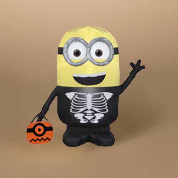 The Inflatable - Minion Dave Skeleton is dressed in a black costume, holding an orange trick-or-treat bag with a zigzag and eye design. Its beige background makes it perfect for highlighting the playful Halloween theme. Available for Pick-up & Delivery.