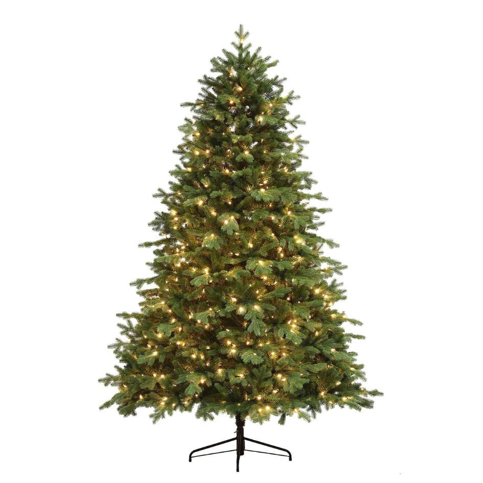 The Thunder Ridge Warm White LED Lights 9 Ft. Christmas tree from Available for Pick-Up & Delivery stands tall on a black metal stand, adorned with warm white LED lights and set against a plain white background.