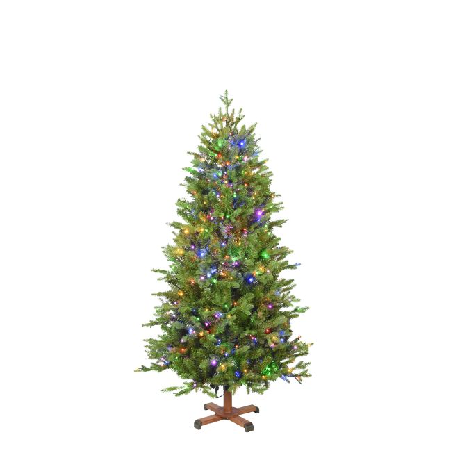 A 5 Ft. Balsam Fir Multi-Function Lights artificial Christmas tree with multicolored lights standing on a wooden X-shaped base.