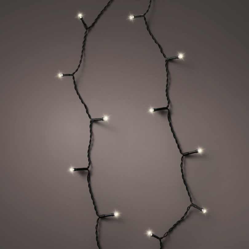 The Durawise Battery Operated LED Twinkle String Lights Warm White by Available for Pickup & Delivery feature a black wire and are perfect for holiday décor. Displayed in a loose curve on a plain gray background.