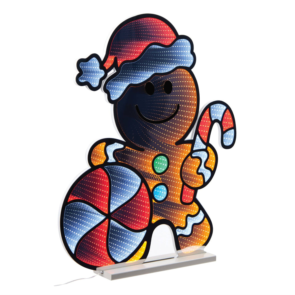 The Infinity Light – Gingerbread Man (29.5) from Available for Pick-Up & Delivery is a charming LED Christmas décor featuring a Santa hat-wearing gingerbread figure with a candy cane and patriotic candy, all illuminated in red, green, and blue on a white base for festive delight.