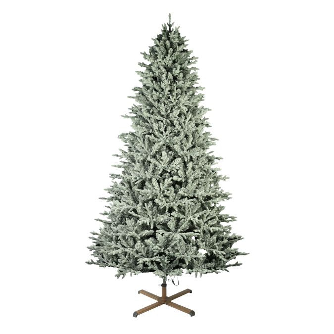 A 9 ft. Nordic Flocked Fir Multi-Function Lights artificial Christmas tree standing on a metal X-shaped base.
