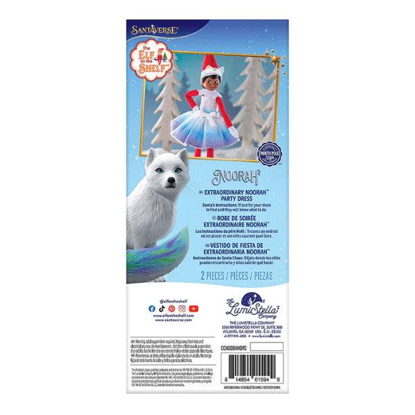 The Elf on the Shelf®: Claus Couture Collection® Extraordinary Noorah™ features a toy in a blue party dress set against a winter scene with trees and northern lights, along with text for product details and contact information. Available for Pick-Up & Delivery.