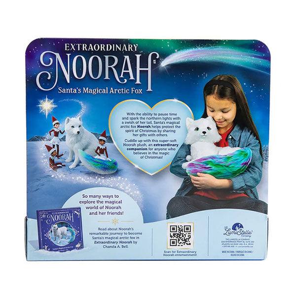 Back of Noorah the fox's packaging which shows a girl holding the fox and a cartoon photo of the fox in the arctic with elves.