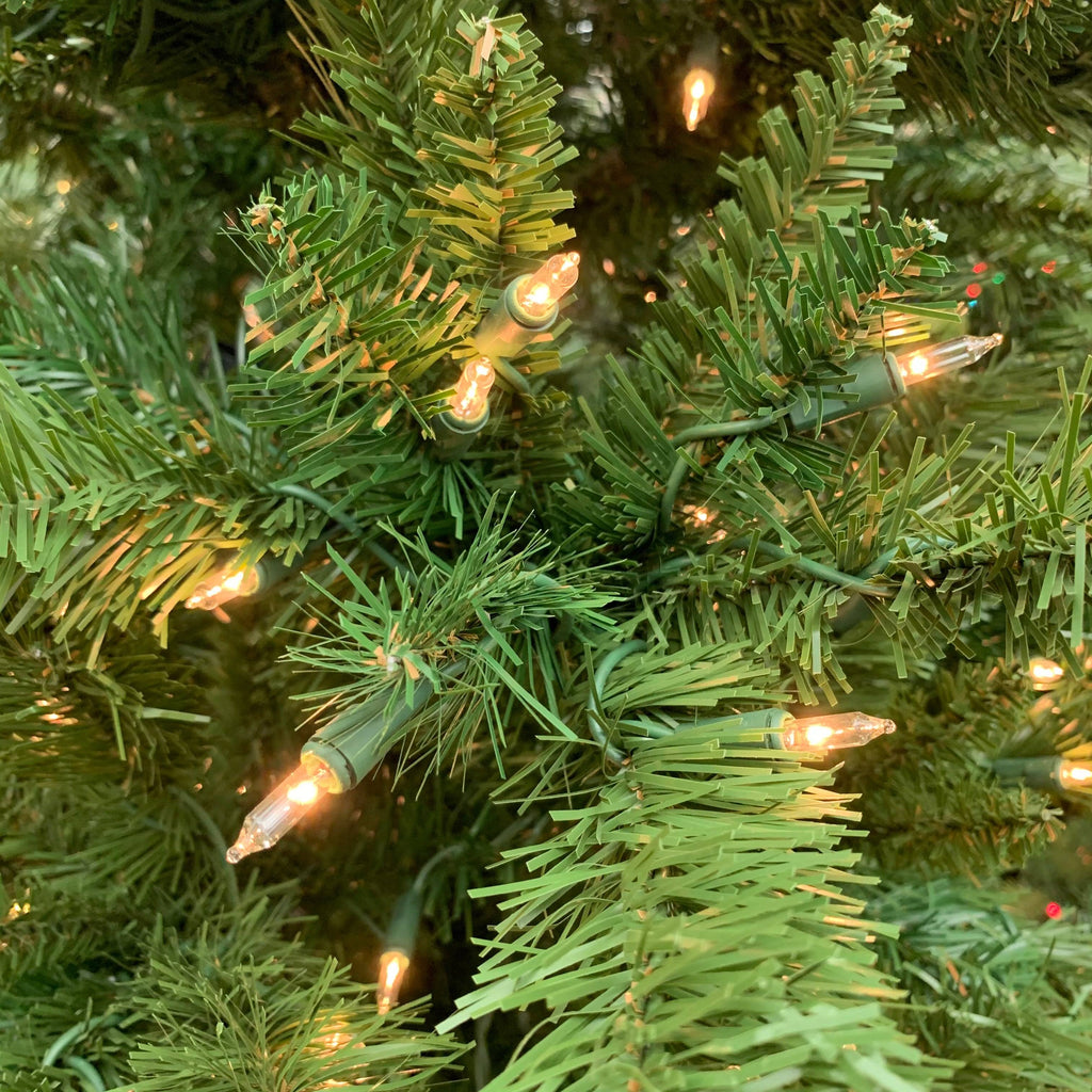 Close-up of Thunder Ridge Warm White LED Lights 10 Ft. from Available for Pick-Up & Delivery, with lifelike pine branches and glowing white LEDs, creating a festive and cozy holiday vibe.