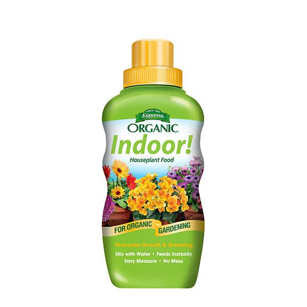 An 8 oz. green bottle of Espoma - Indoor! Organic Fertilizer by All Delivery Options, with a yellow cap and flower images, promotes all-natural growth for indoor organic houseplants.