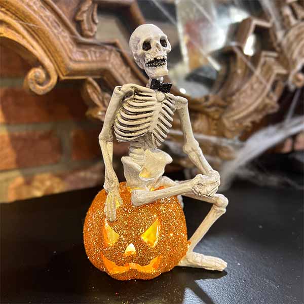 Skeleton Sitting on a Pumpkin - 6"