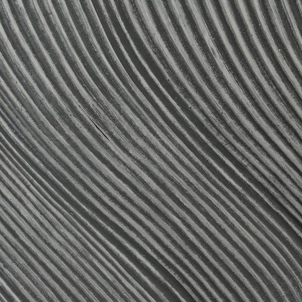 Close-up of the Jade Planter - Black (12.6-in) by All Delivery Options, featuring a textured surface with evenly spaced wavy parallel lines in gray shades, forming a striped abstract design.