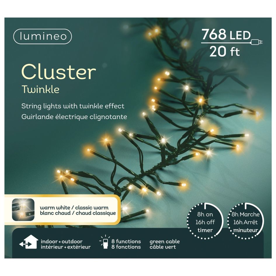 A 20-ft Cluster LED 768 ct. String Lights Warm White from Available for Pick-Up & Delivery, with glowing twinkle LEDs on a black wire, shown with feature icons and bilingual English/French text on the packaging.